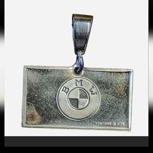 BMW pendant, 15x22mm, 0.15" thick, featuring a BMW logo with a BMW date stamp on